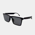 VAUCLIOR SORE ONE black rectangular sunglasses with dark grey lenses and red accent detail on the arms.