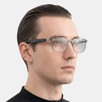 VAUCLIOR VC IRIS NANO smart glasses with full-frame gunmetal and clear lenses, featuring Bluetooth 5.4 technology.