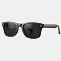 VAUCLIOR VC AXE GEN1 lunettes intelligentes noires rectangulaires en TP mat avec objectif circulaire sur la branche.