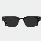 VAUCLIOR VC CORE smart glasses with black frames, silver accents, and integrated camera. Half-rim design.