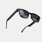 VAUCLIOR VC NOVA G1 black smart glasses with dual cameras and integrated Bluetooth headphones.