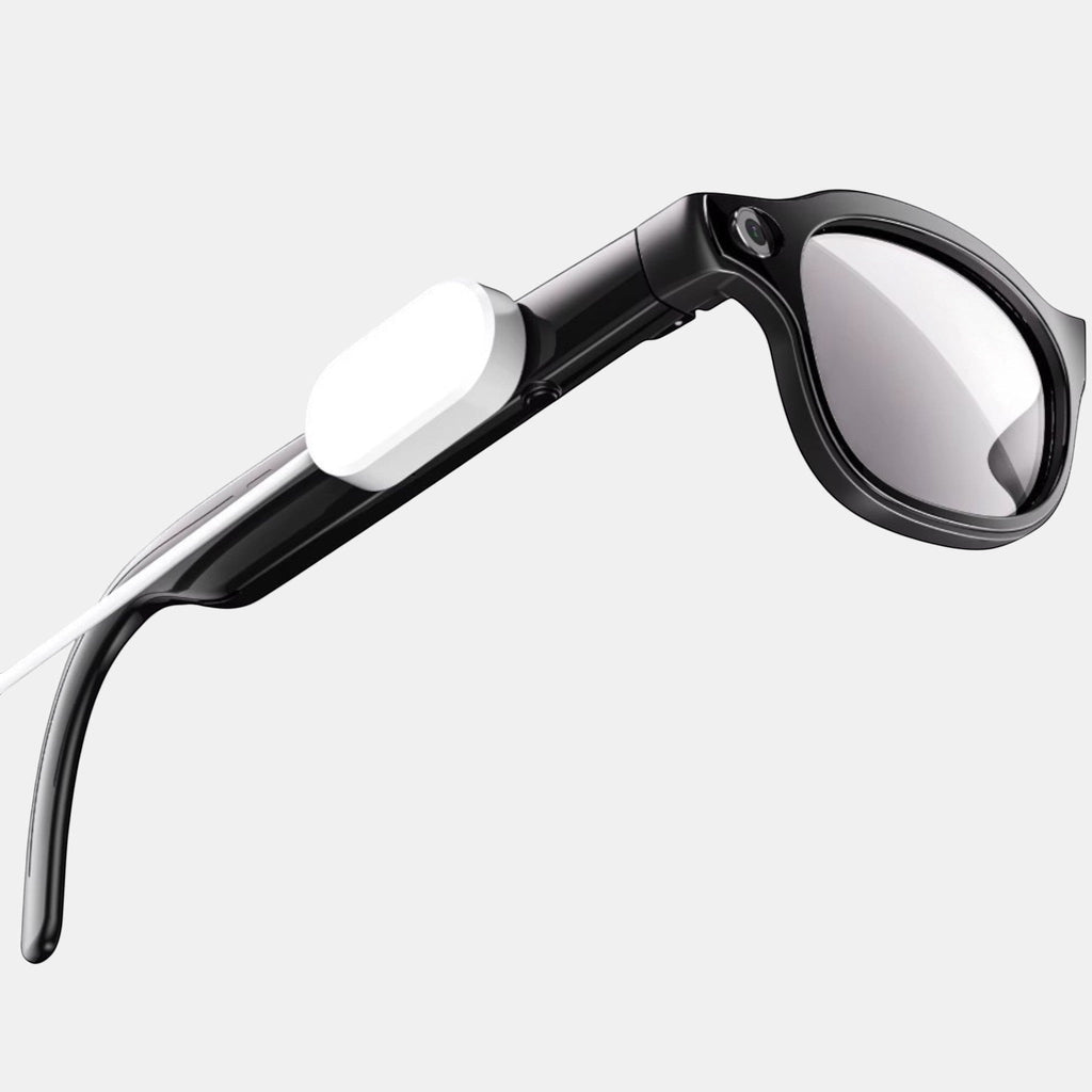 VAUCLIOR VC PRISM PRO smart glasses in black with an 8MP camera and charging cable attached.